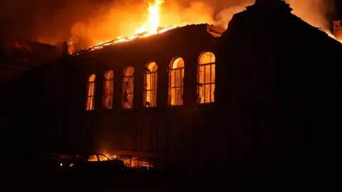 Нічна атака дронів на Запоріжжя: поранений, пожежі в ТЦ та університеті